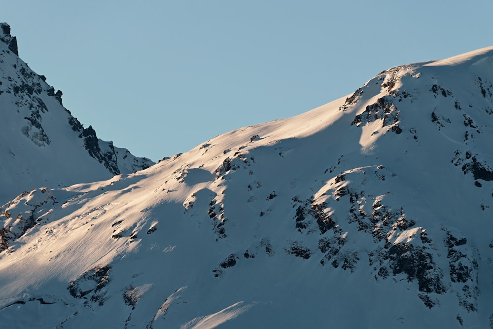 snow covered mountain during daytime