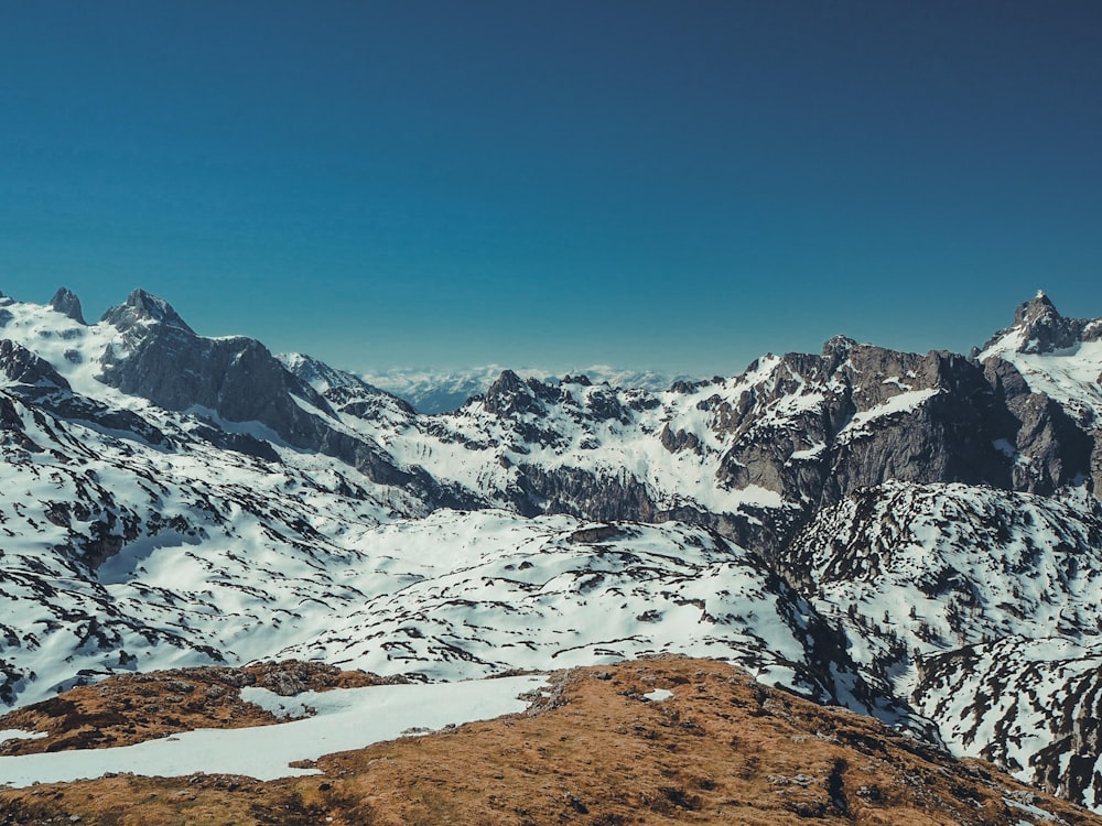 snow covered mountain under blue sky during daytime