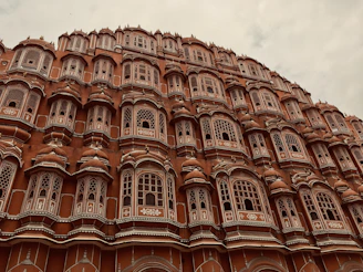 Elegant red sandstone townhouse with intricate architectural details.