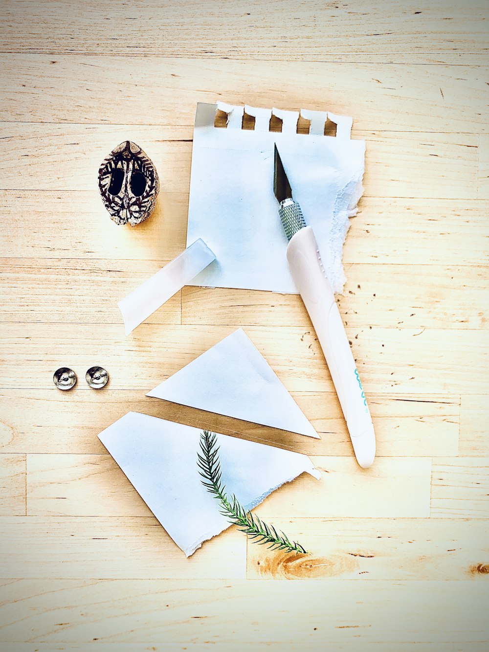 white handled knife on white chopping board