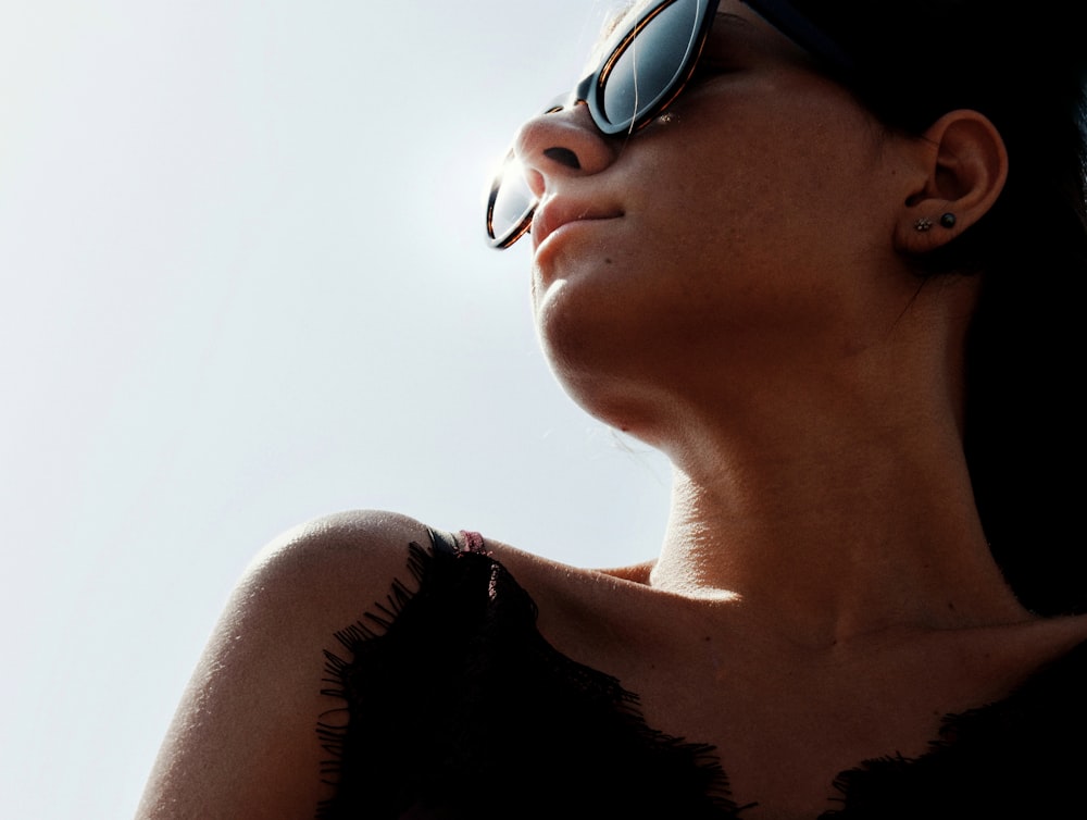 woman in black tank top wearing black sunglasses