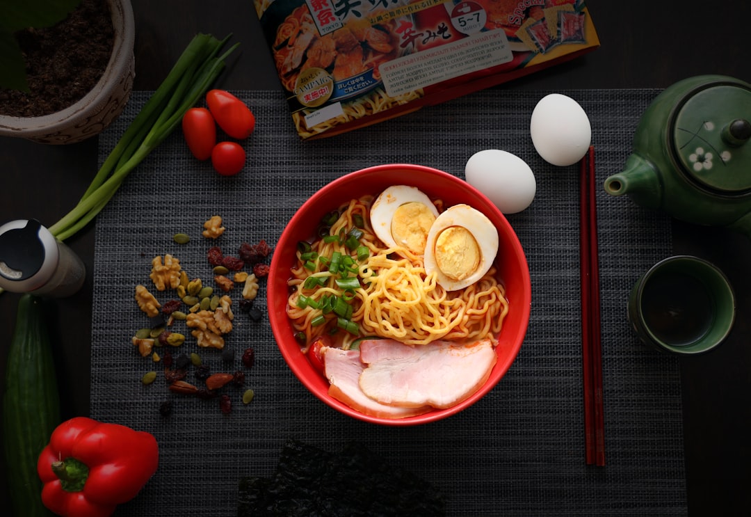 pasta with sliced vegetables on red ceramic plate, Ramen