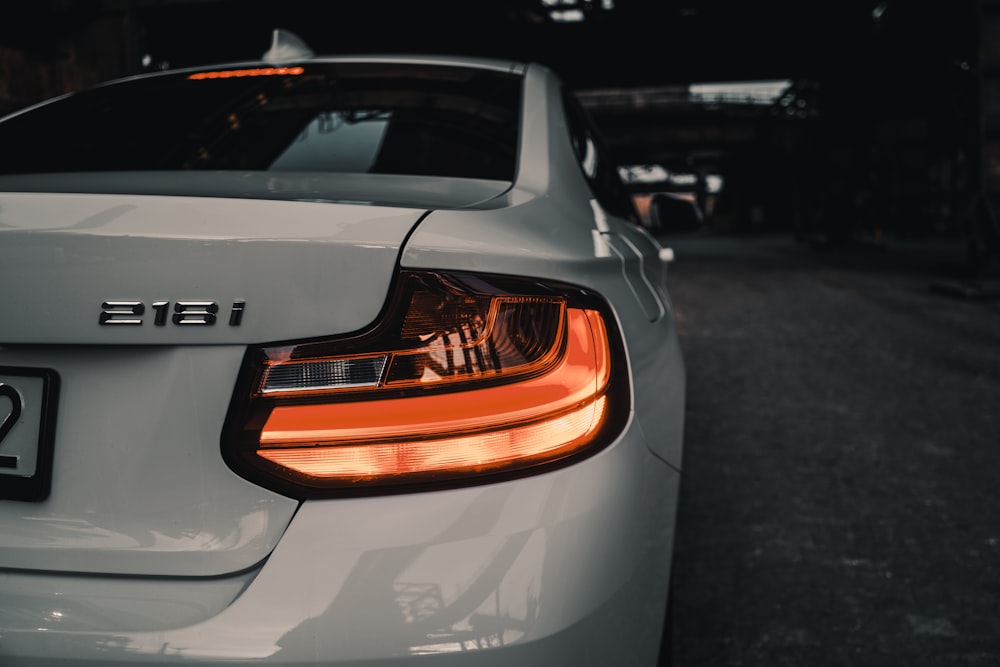 white audi a 4 on road during daytime