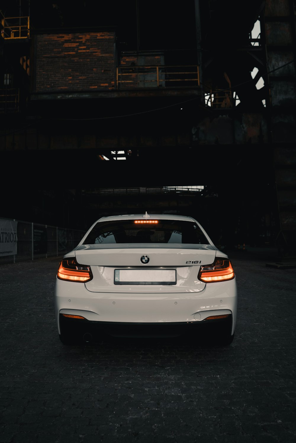 white car parked on road