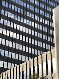A sleek office complex with glass facades reflecting the sky.