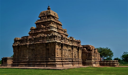 brown concrete building under blue sky during daytime in Pattadakal India