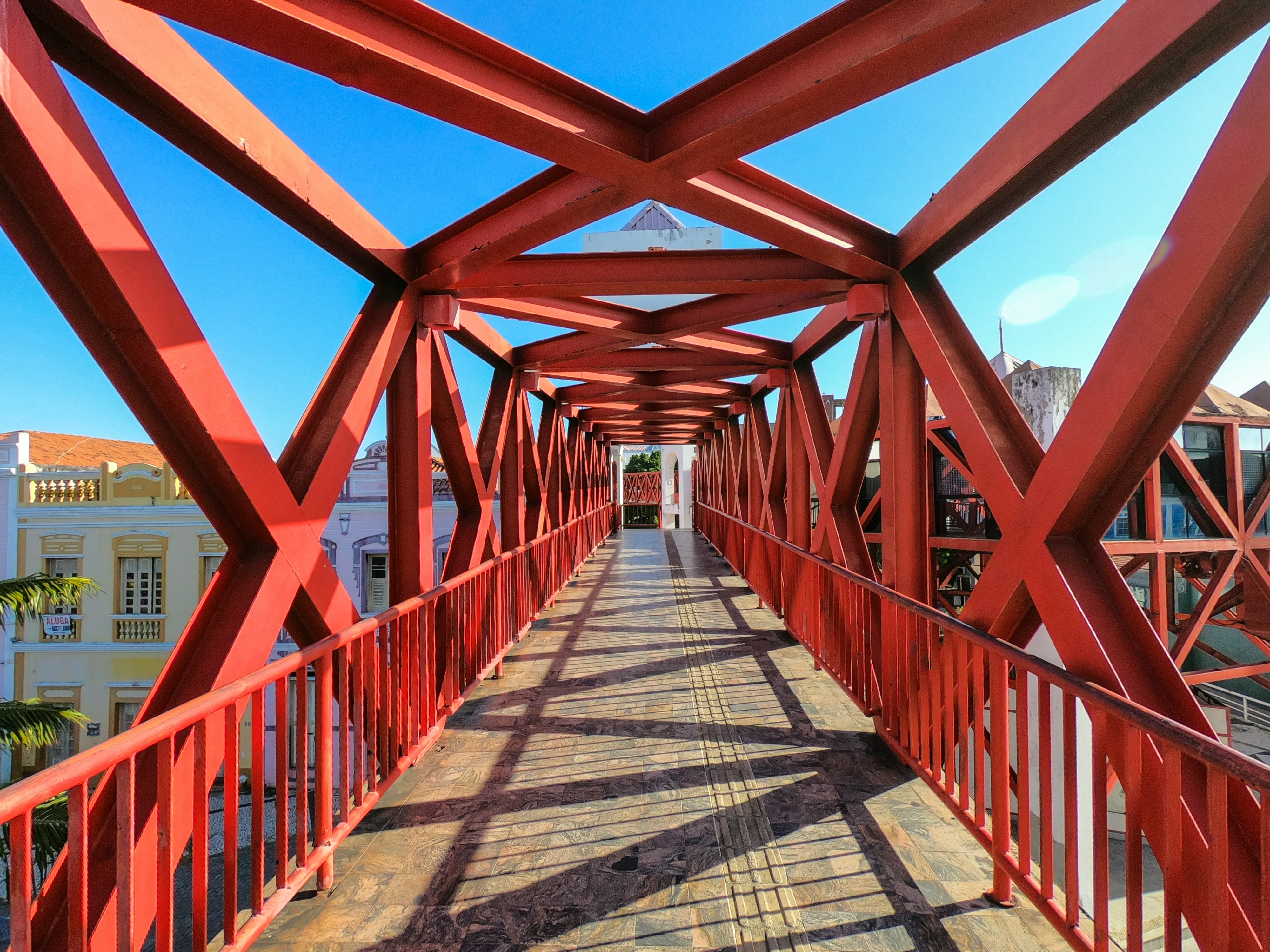 brown wooden bridge under blue sky during daytime