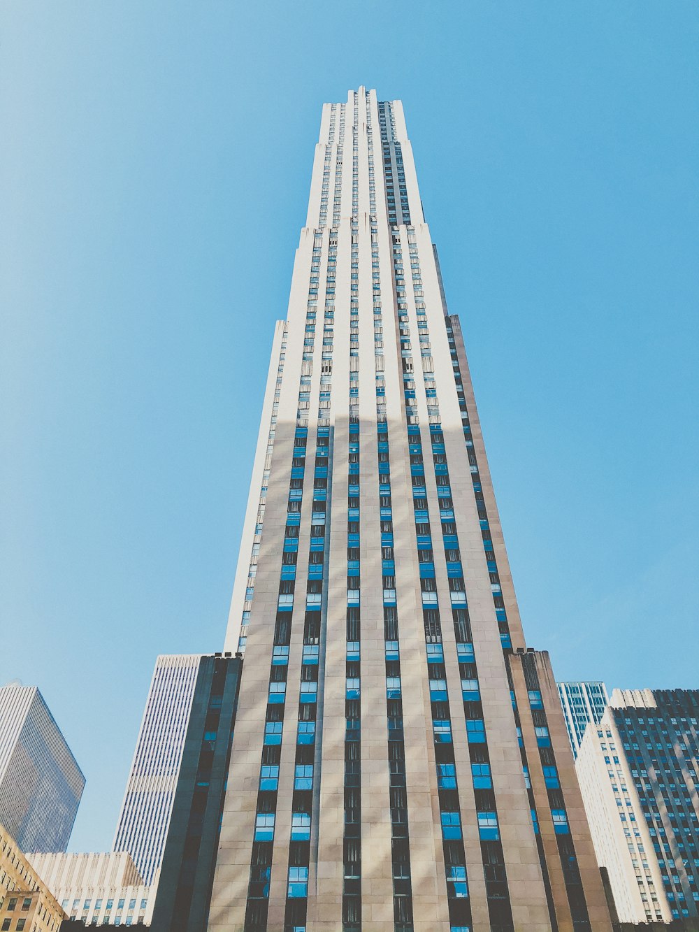 blue and white concrete building under blue sky during daytime