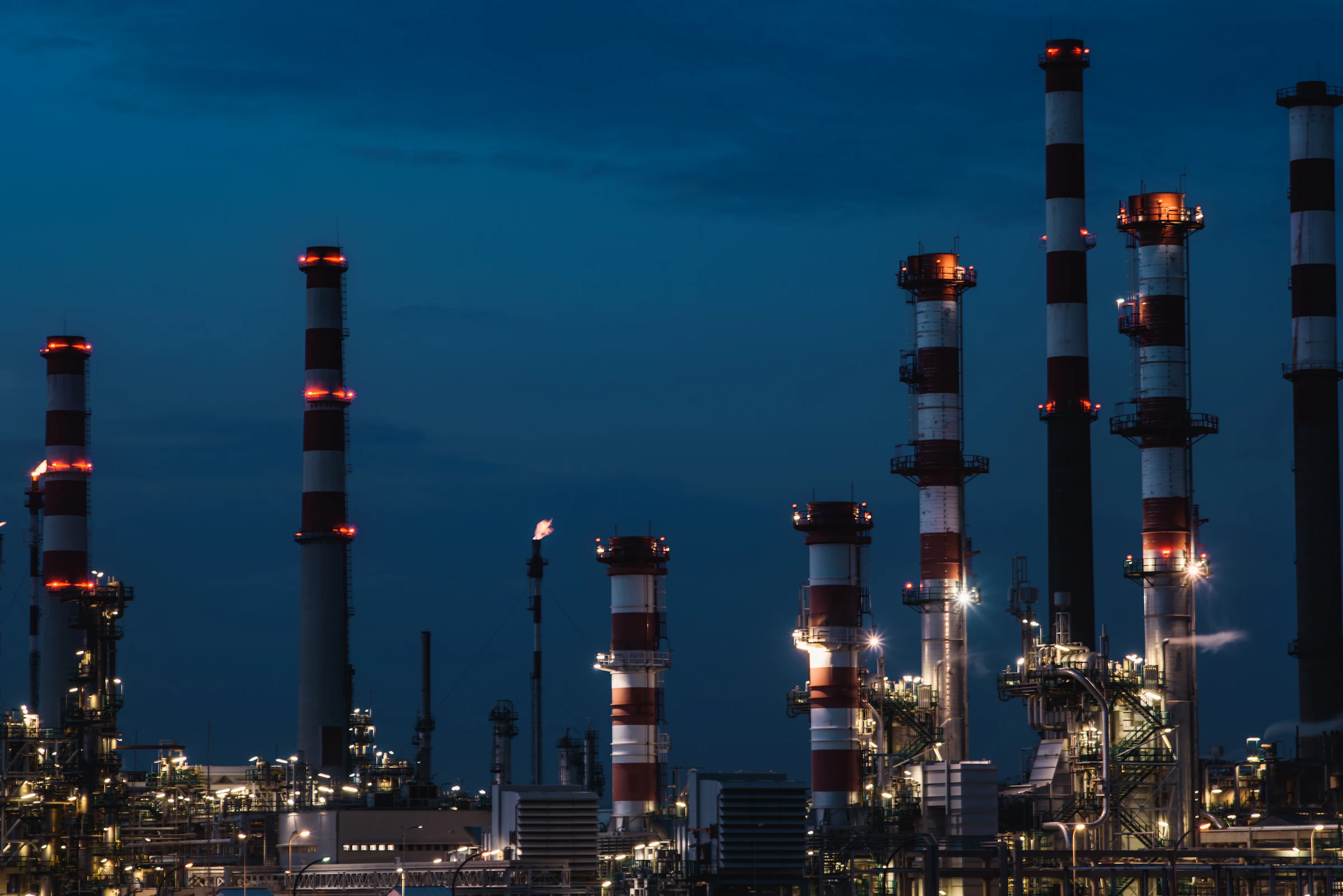 Industrial refinery infrastructure at dusk