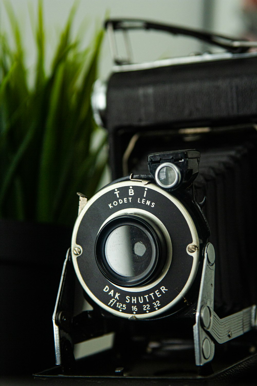 black and silver camera in tilt shift lens