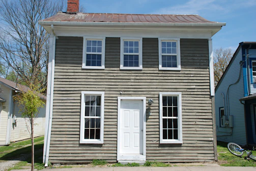 Compact two-bedroom knockdown house with a small porch