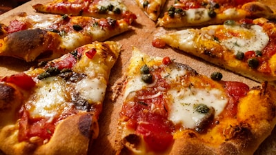 pizza with cheese and green leaves