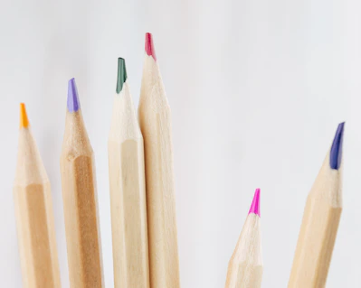 brown wooden pencils on white surface