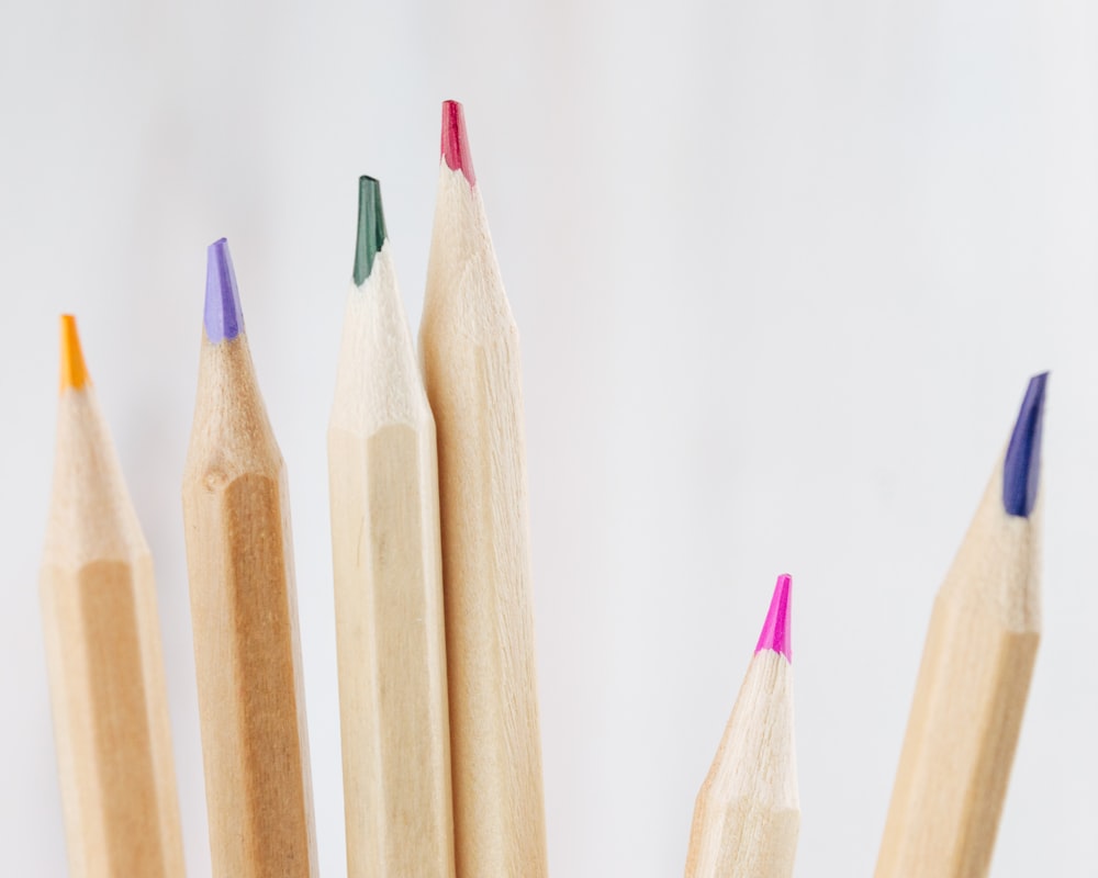 brown wooden pencils on white surface