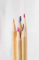 brown wooden pencil on white surface