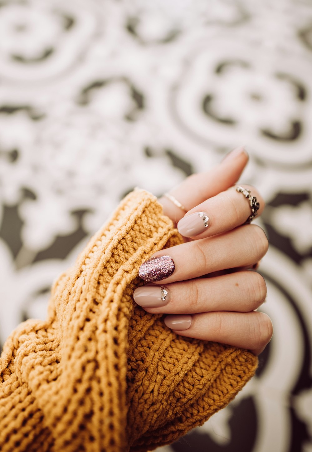 person wearing silver diamond ring