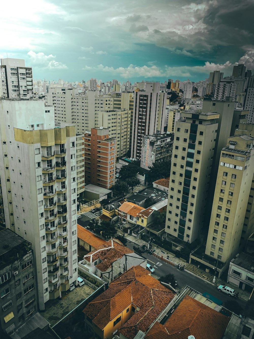 white and brown concrete buildings under blue sky during daytime