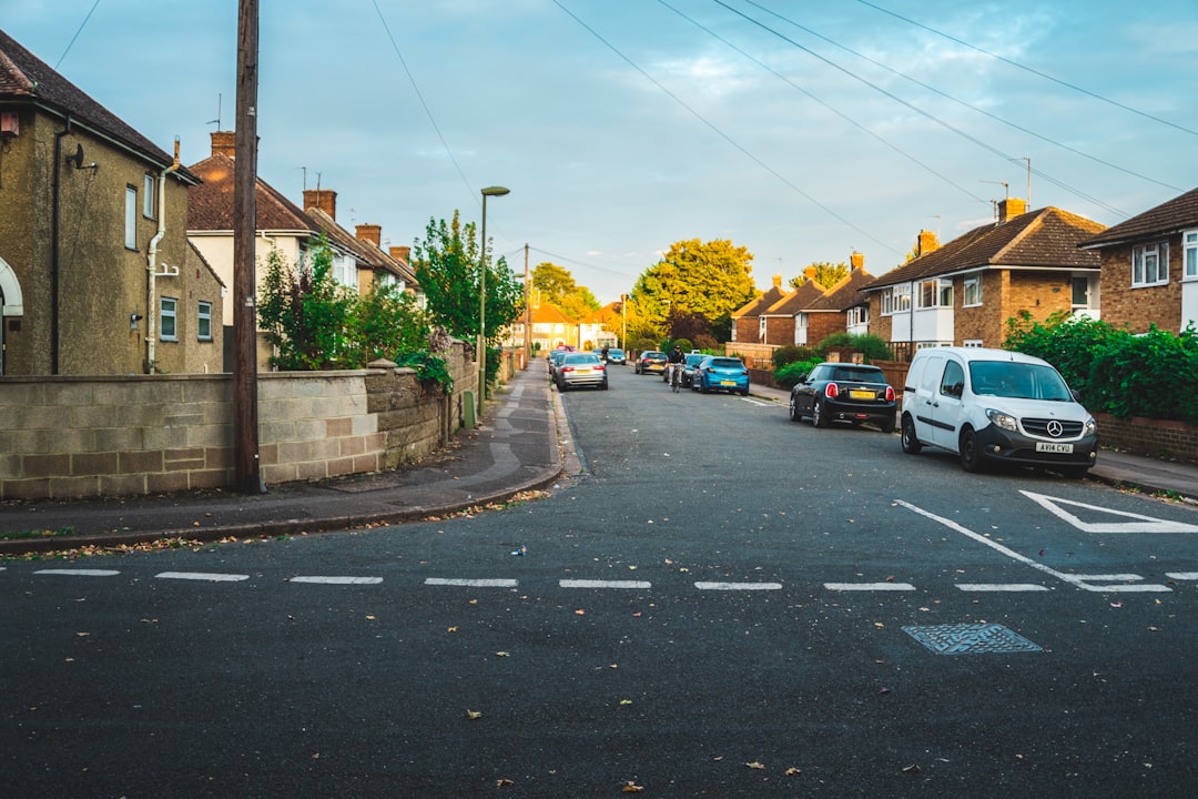 cars parked on side of the road during daytime