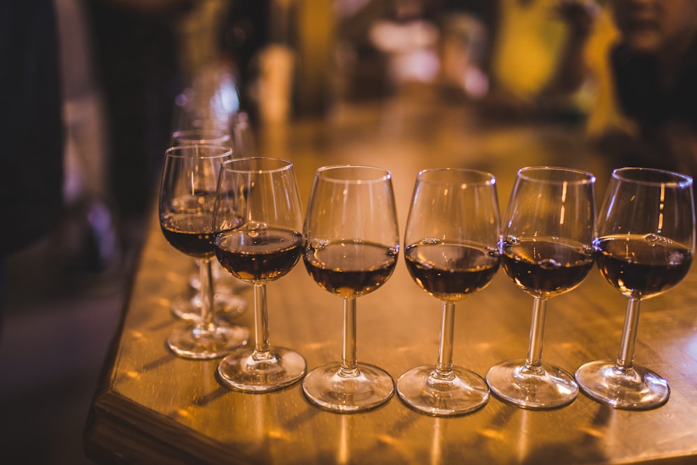 clear wine glass on brown wooden table