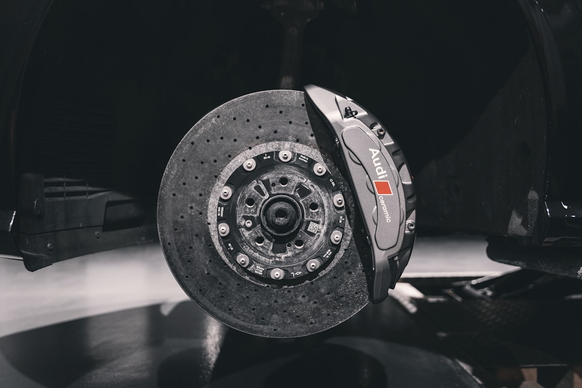 Apex Race-Spec front brake pads against caliper