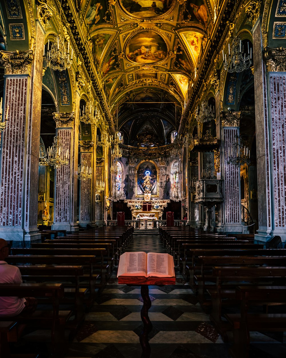 a large cathedral with a red table in the middle of it