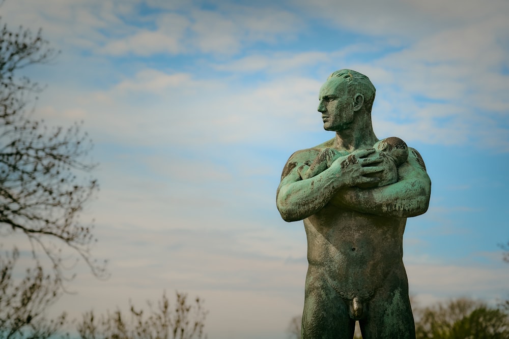 gray concrete statue of man