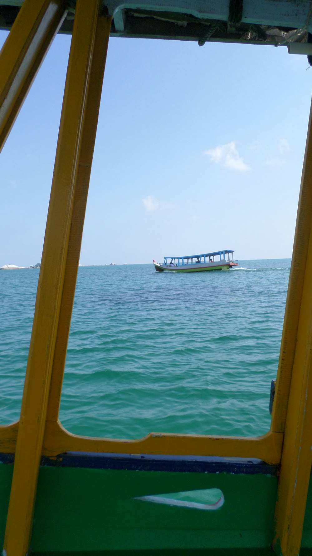 white and red boat on sea during daytime