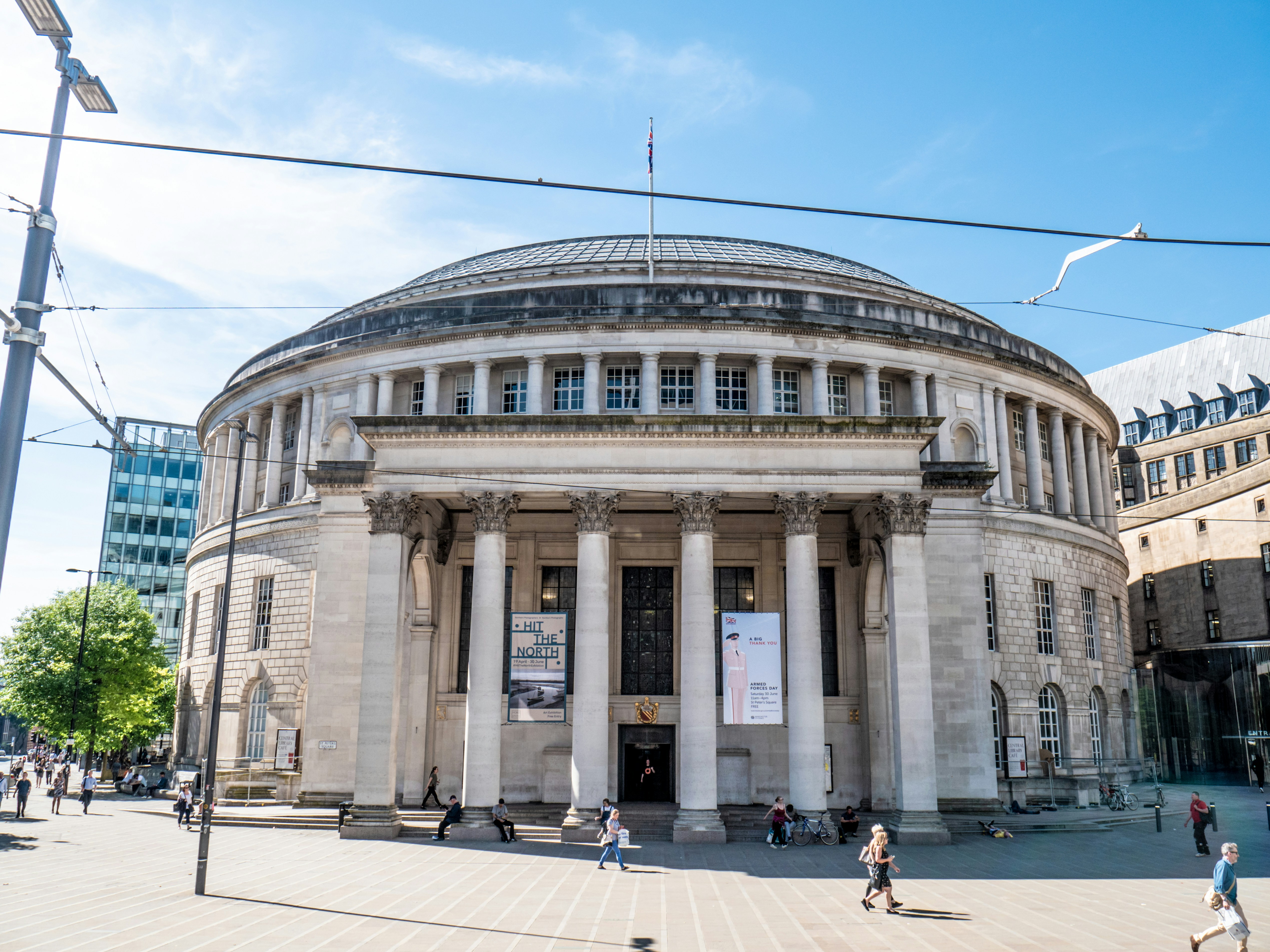 Manchester's Central Library capture during a busy afternoon with people walking about.