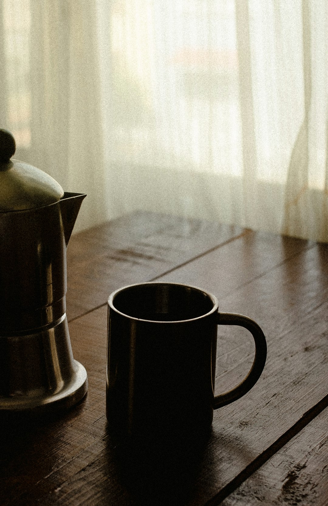 black ceramic mug on table