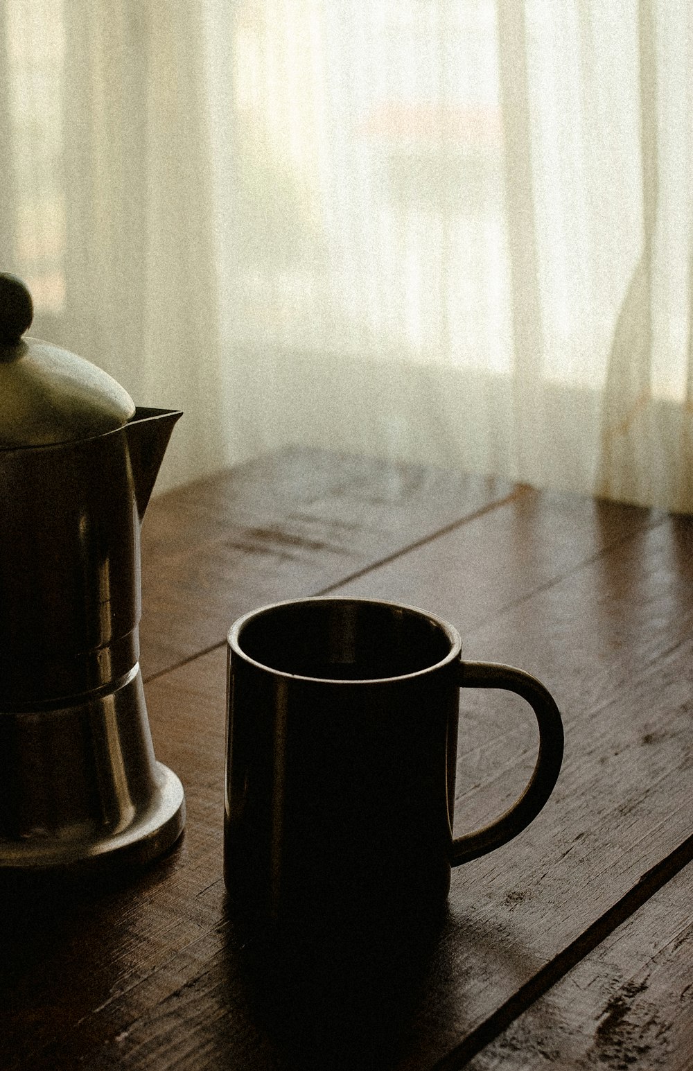 black ceramic mug on table