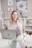 woman in white lace long sleeve shirt using silver macbook