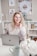 woman in white lace long sleeve shirt using silver macbook