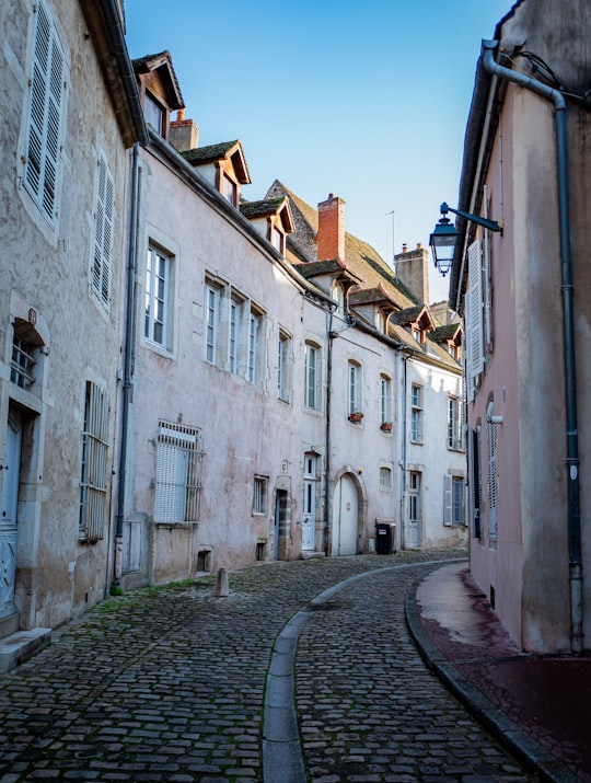 white concrete building near road during daytime in Beaune France