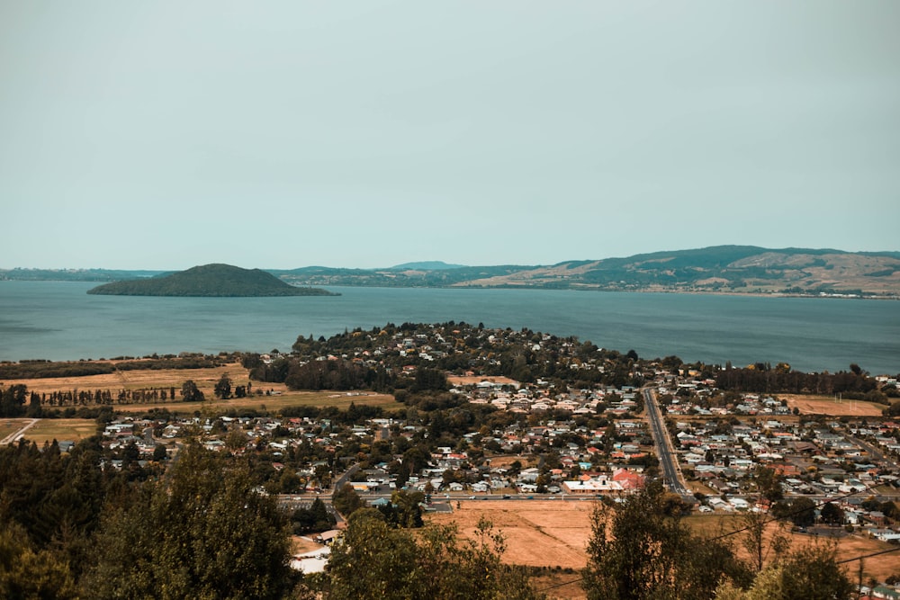 aerial view of city near body of water during daytime