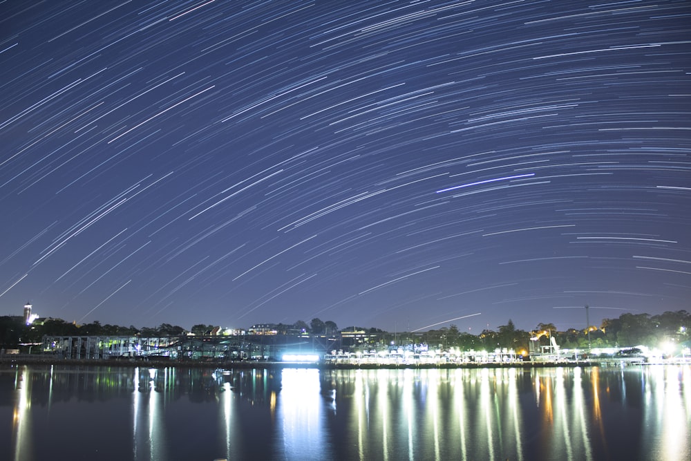 the night sky is reflected in the water