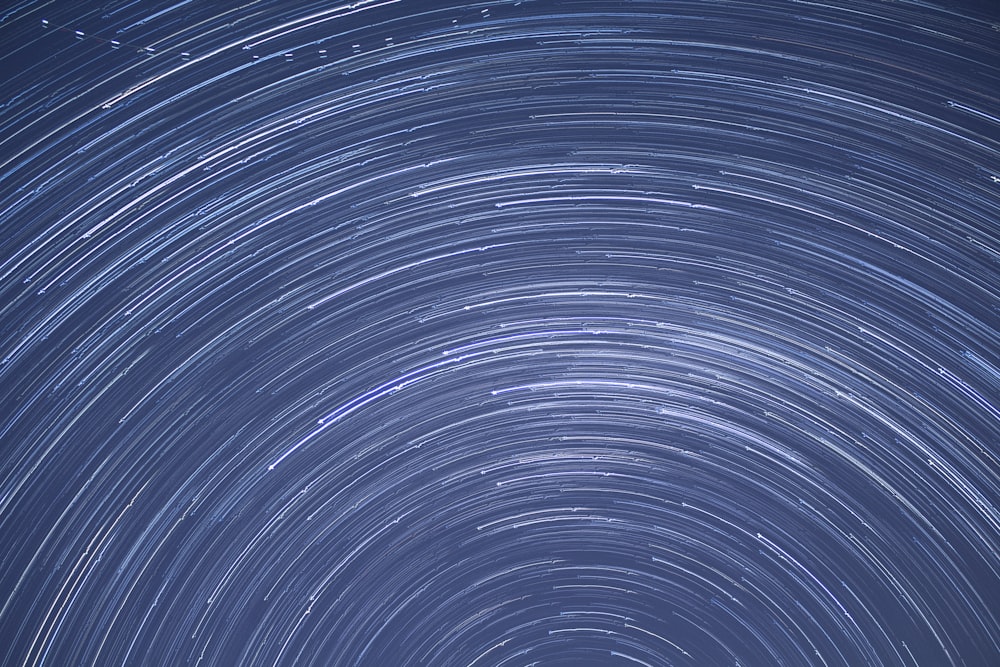 a star trail is seen in the night sky