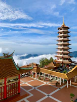 brown and green pagoda temple under blue sky during daytime