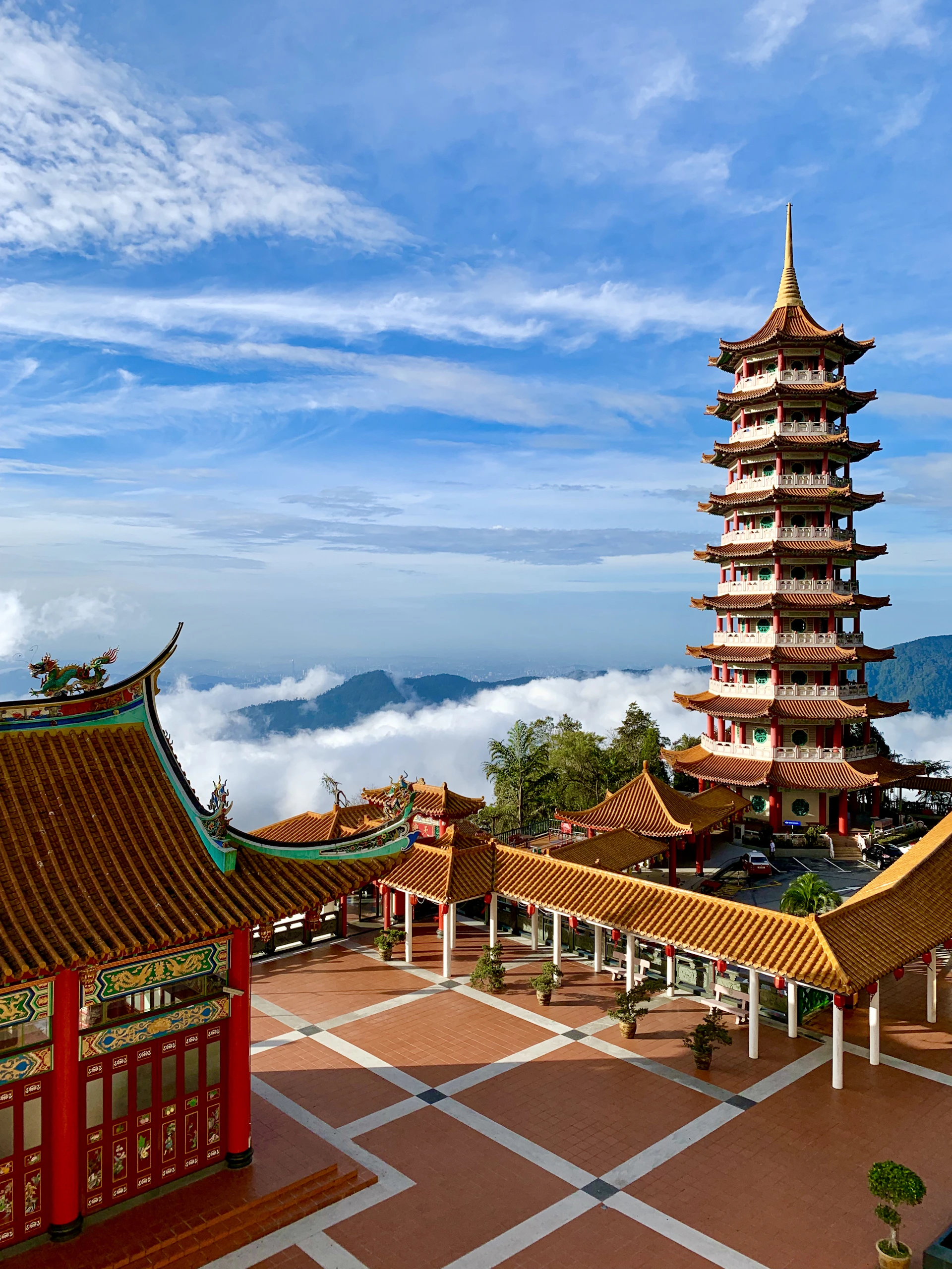 brown and green pagoda temple under blue sky during daytime