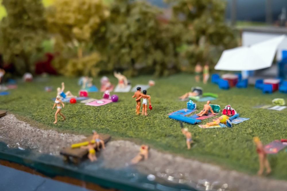 children playing on the ground with blue inflatable ring