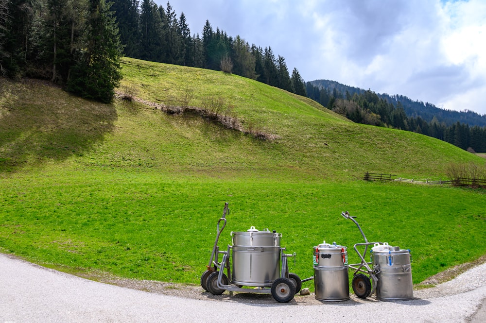 gray metal container on green grass field