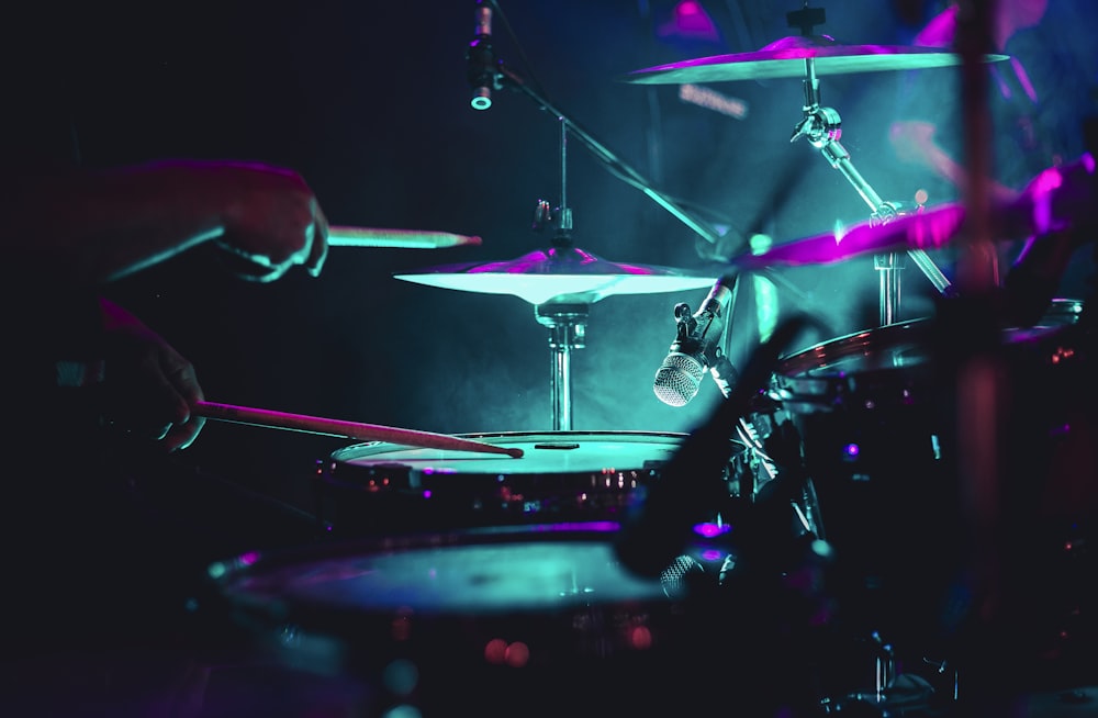 man playing drum set on stage