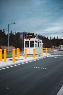 A friendly security guard welcoming visitors at a modern office entrance.