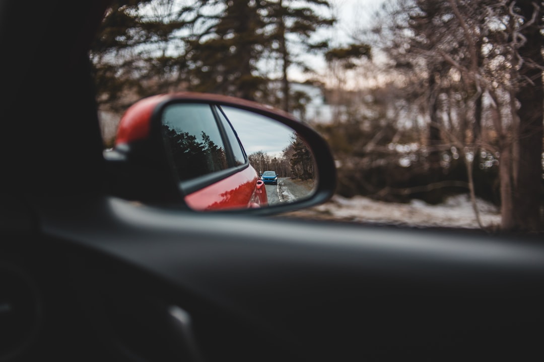 car side mirror showing car