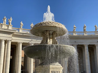 white concrete building with water fountain