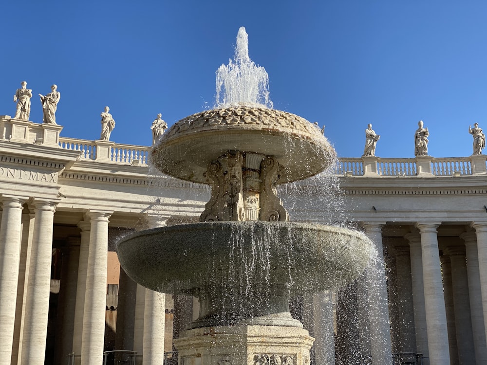 white concrete building with water fountain