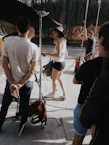 A vibrant behind-the-scenes photo of a diverse group of talents preparing for a shoot on a sunny Lanzarote beach.