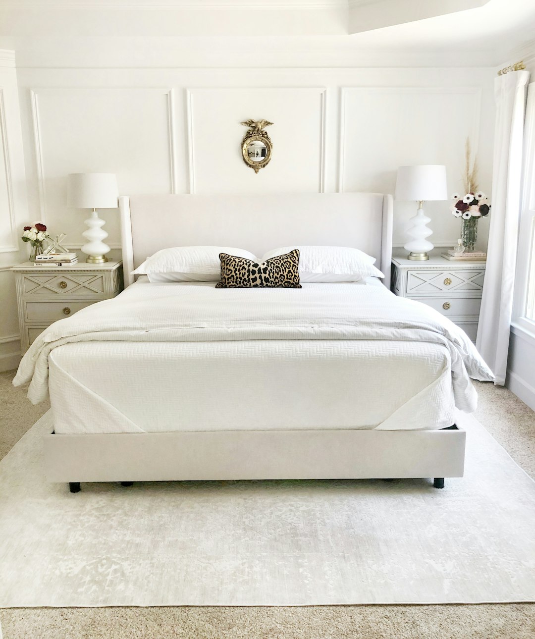  white bed with white bed linen bed