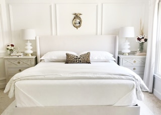 white bed with white bed linen