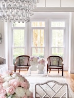 A bright and airy living room decorated with fresh flowers and natural textures.