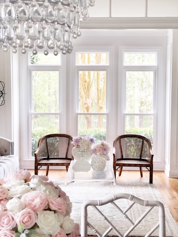 A bright, sunlit living room freshly cleaned with sparkling surfaces and soft rainbow accents visible in the decor.